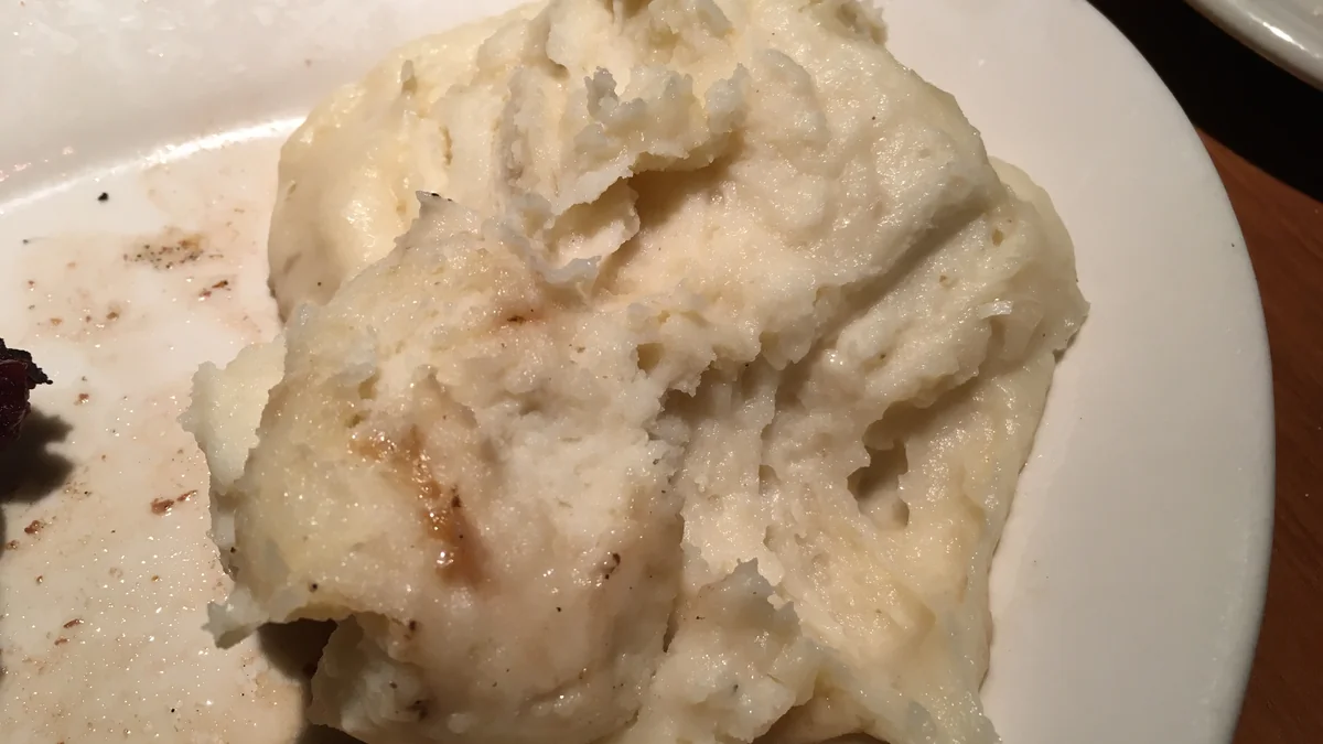 Fluffy Homemade Mashed Potatoes Recipe Garnished with Fresh Chives